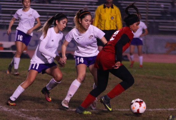 No. 11 Lizzy Pimentel and No. 14 Taylor Paramo in Monday's game against Hanford.
